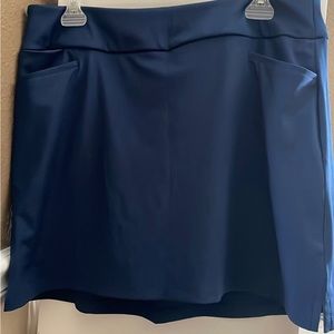 Women’s adidas athletic skort, with pockets. Dark blue size large, new with tags